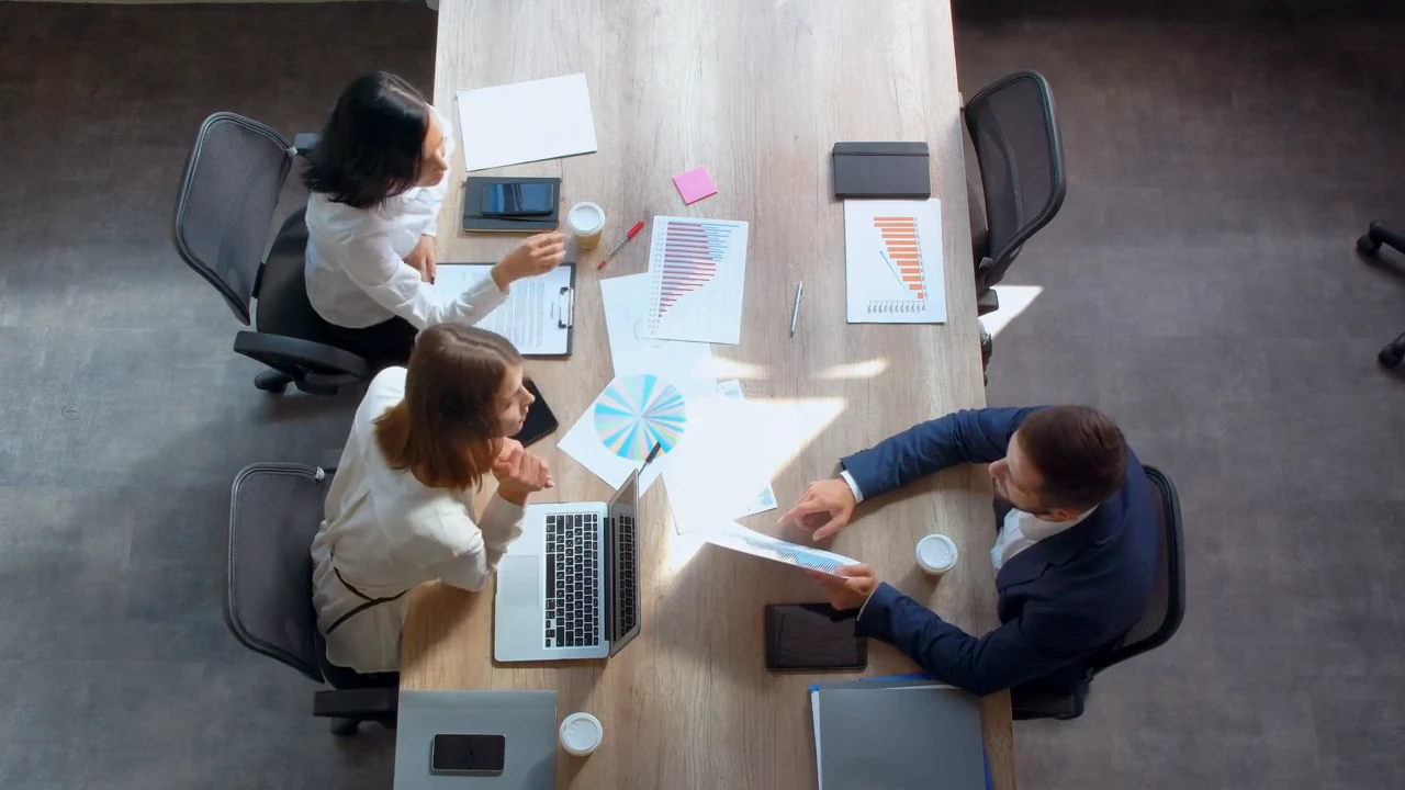 Illustrative business colleagues reviewing shared information