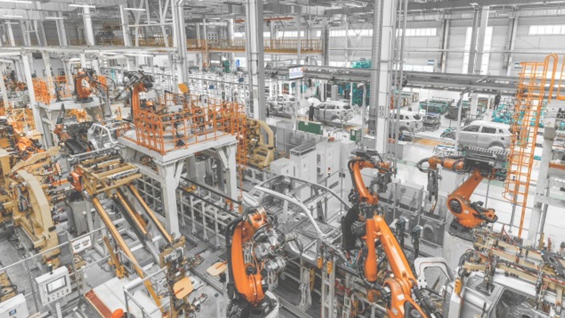 An industrial production hall with multiple pieces of equipment.